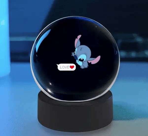 Cute Sphere Vision 3D hologram display ball with animated LED visual effects on a desktop