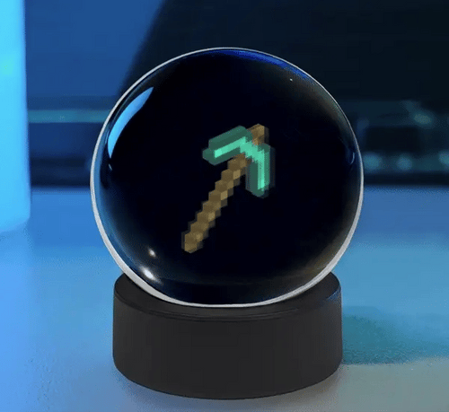 Cute Sphere Vision 3D hologram display ball with animated LED visual effects on a desktop